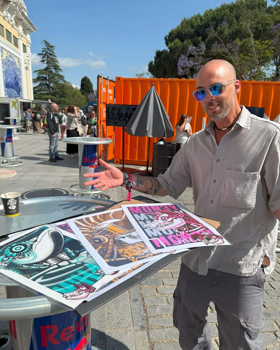 Skeenee presenting prints at an event.